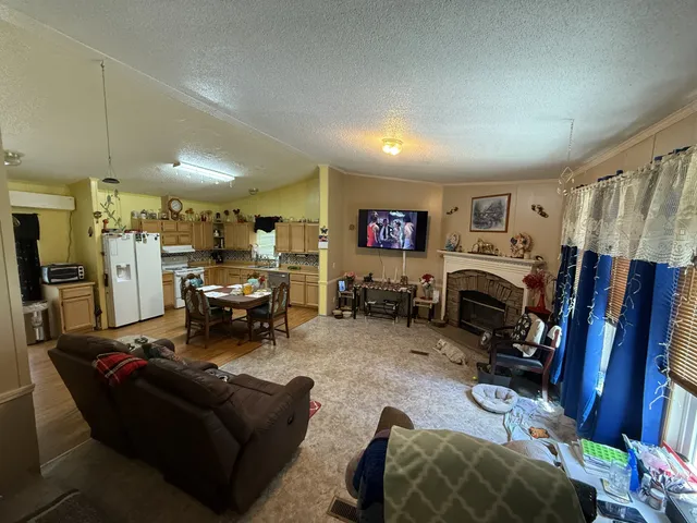 a living room with lots of furniture and a flat screen tv