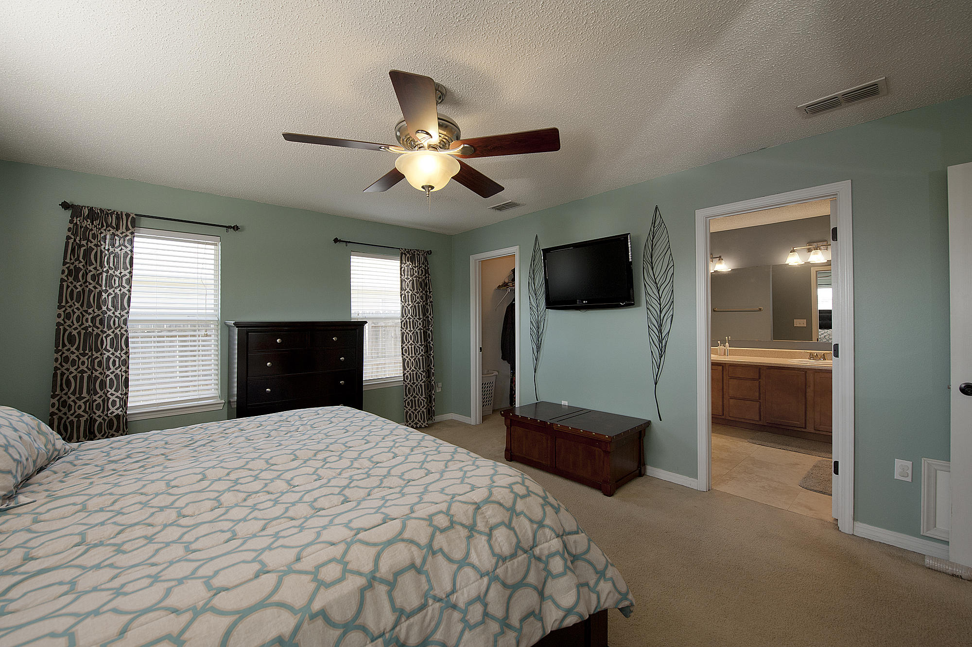 291 Limestone Circle Crestview, FL 32539 - Photo 11 of 19 a bedroom with a bed and a large window