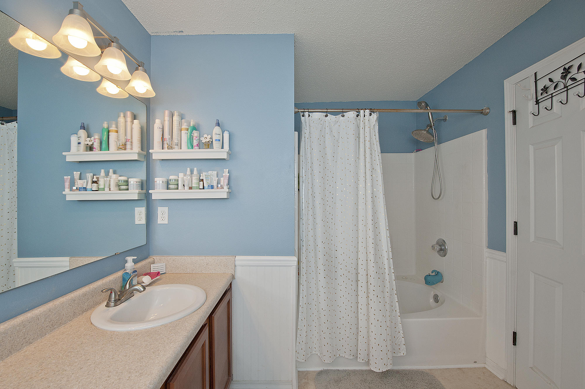 291 Limestone Circle Crestview, FL 32539 - Photo 12 of 19 a bathroom with a sink a mirror and a shower