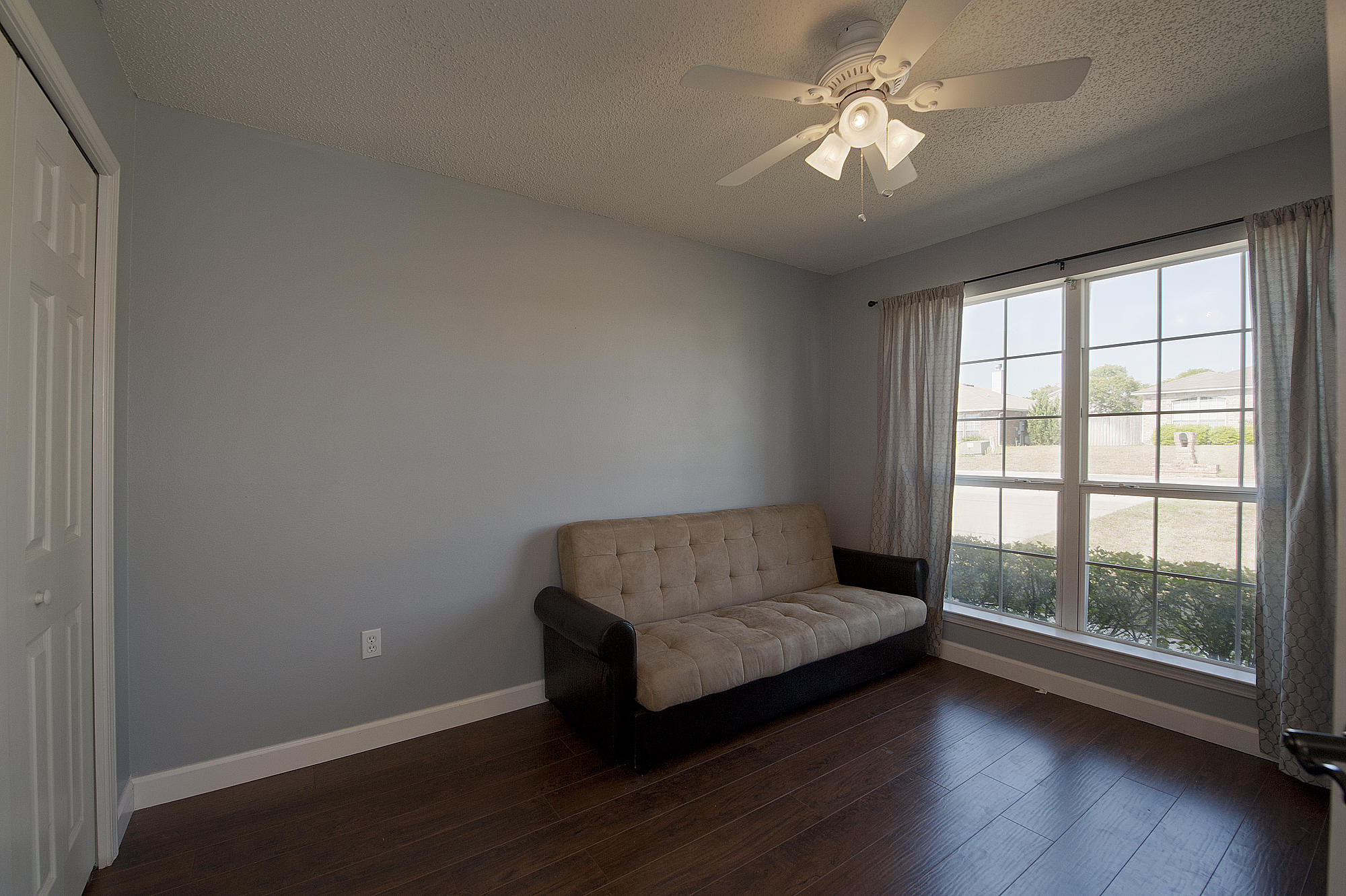 291 Limestone Circle Crestview, FL 32539 - Photo 16 of 19 a living room with furniture and a large window