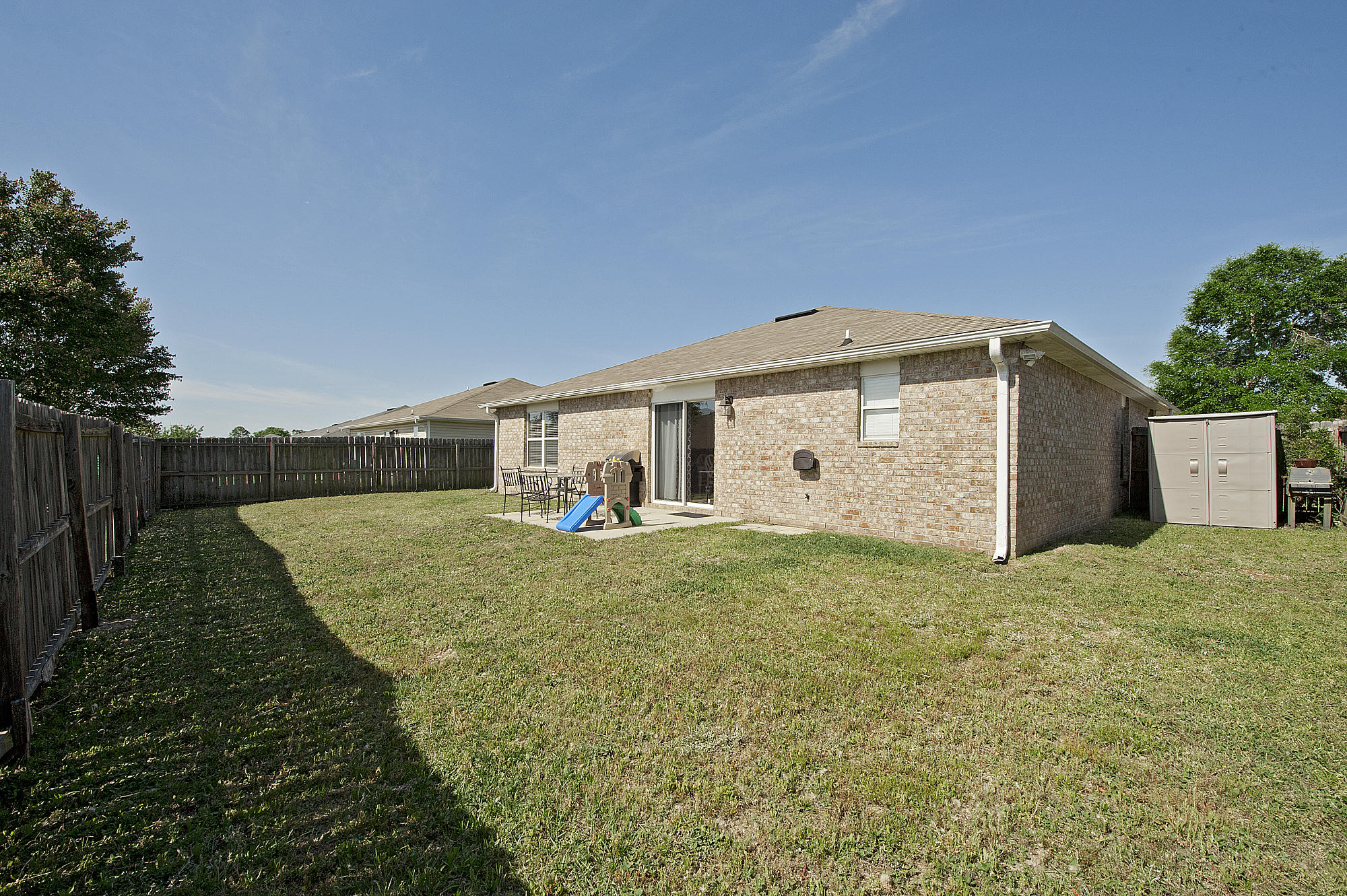 291 Limestone Circle Crestview, FL 32539 - Photo 18 of 19 a front view of house with backyard and green space