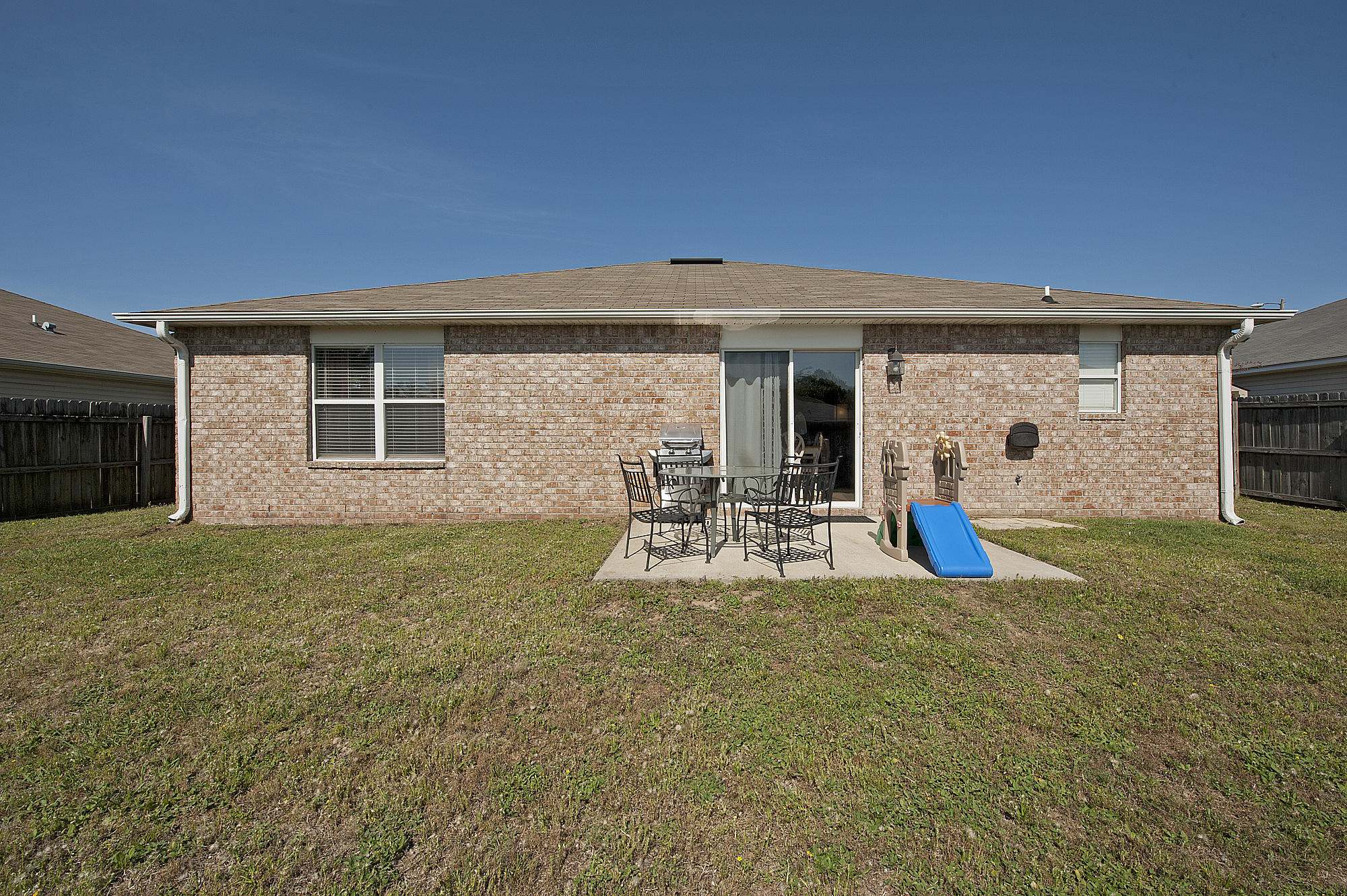 291 Limestone Circle Crestview, FL 32539 - Photo 19 of 19 a view of a house with backyard and porch