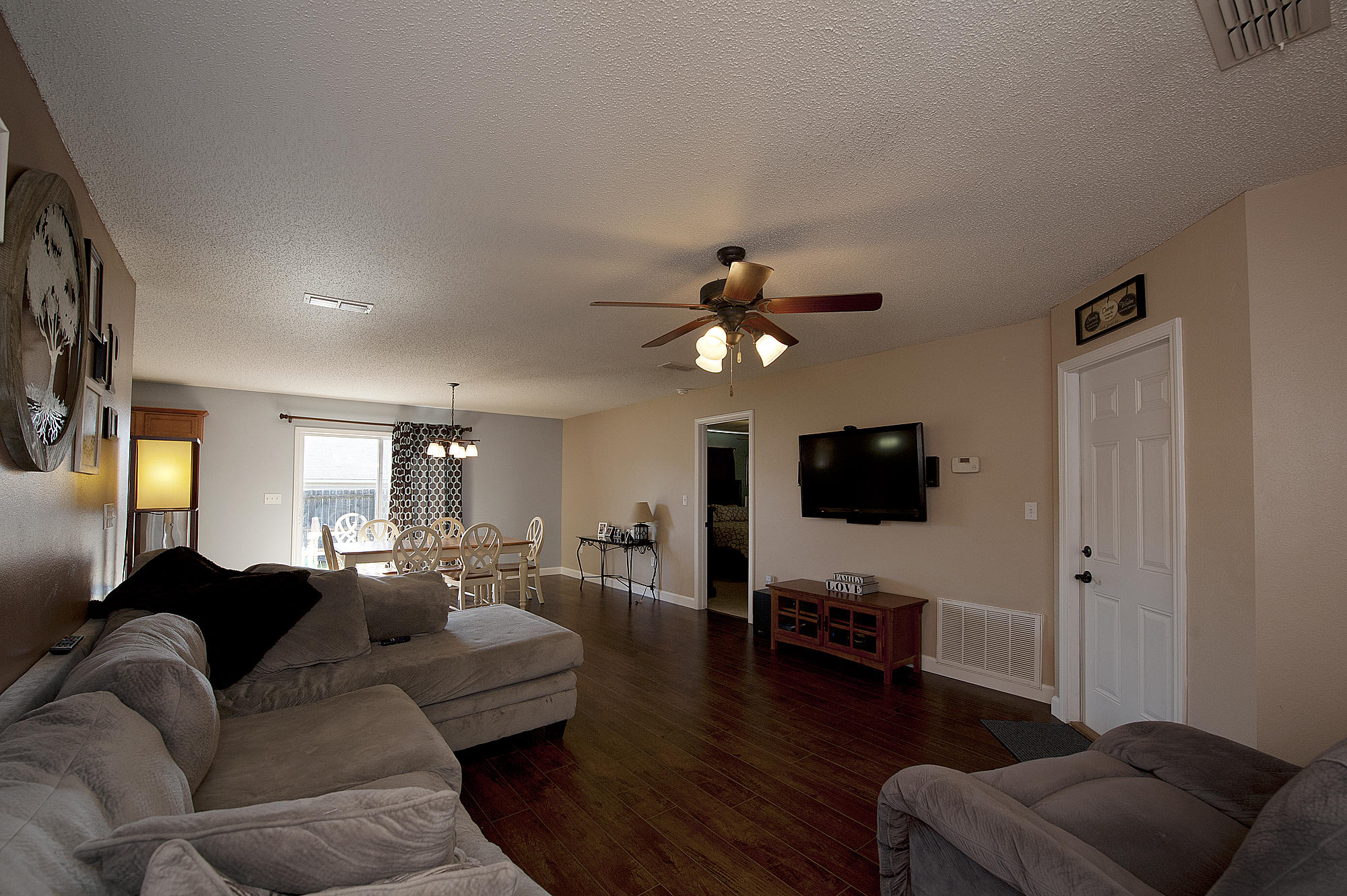 291 Limestone Circle Crestview, FL 32539 - Photo 4 of 19 a living room with furniture and a flat screen tv