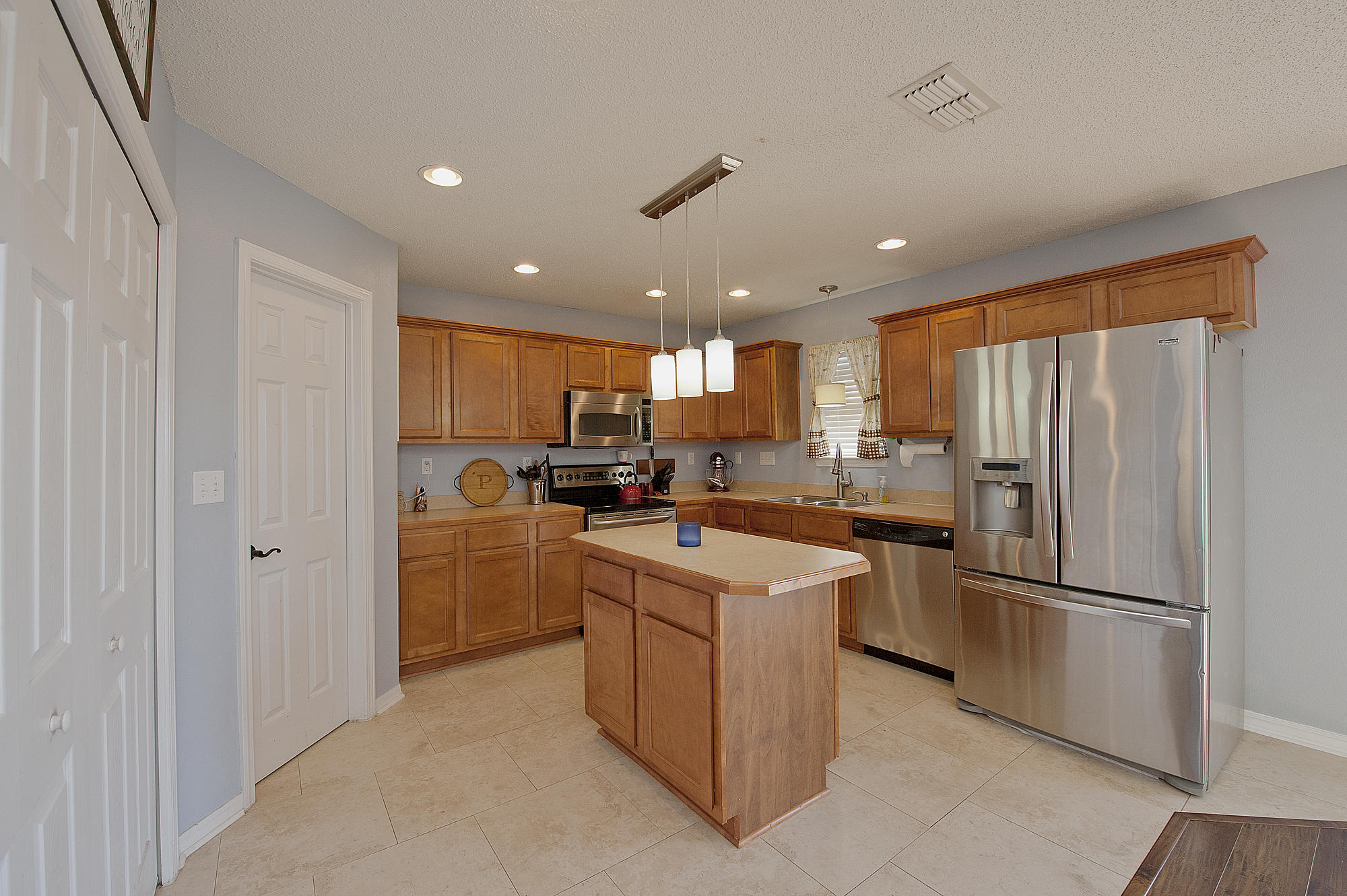 291 Limestone Circle Crestview, FL 32539 - Photo 9 of 19 a kitchen with cabinets and stainless steel appliances