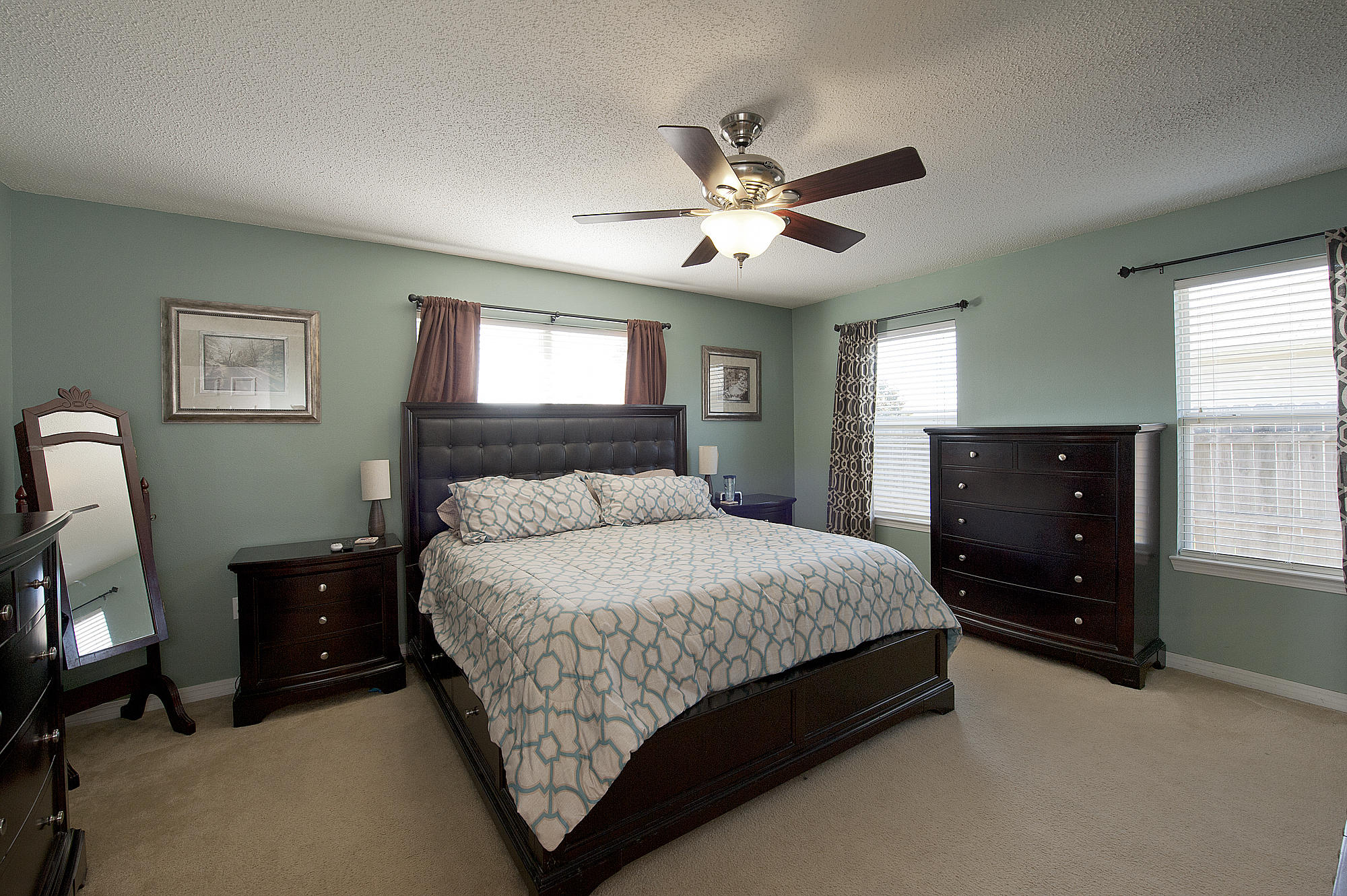 291 Limestone Circle Crestview, FL 32539 - Photo 10 of 19 a bedroom with a bed and a chandelier