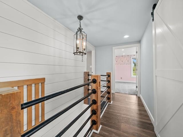 8294 North Leaf River Road Leaf River, IL 61047 - Photo 21 of 56 a view of a hallway with wooden floor and staircase