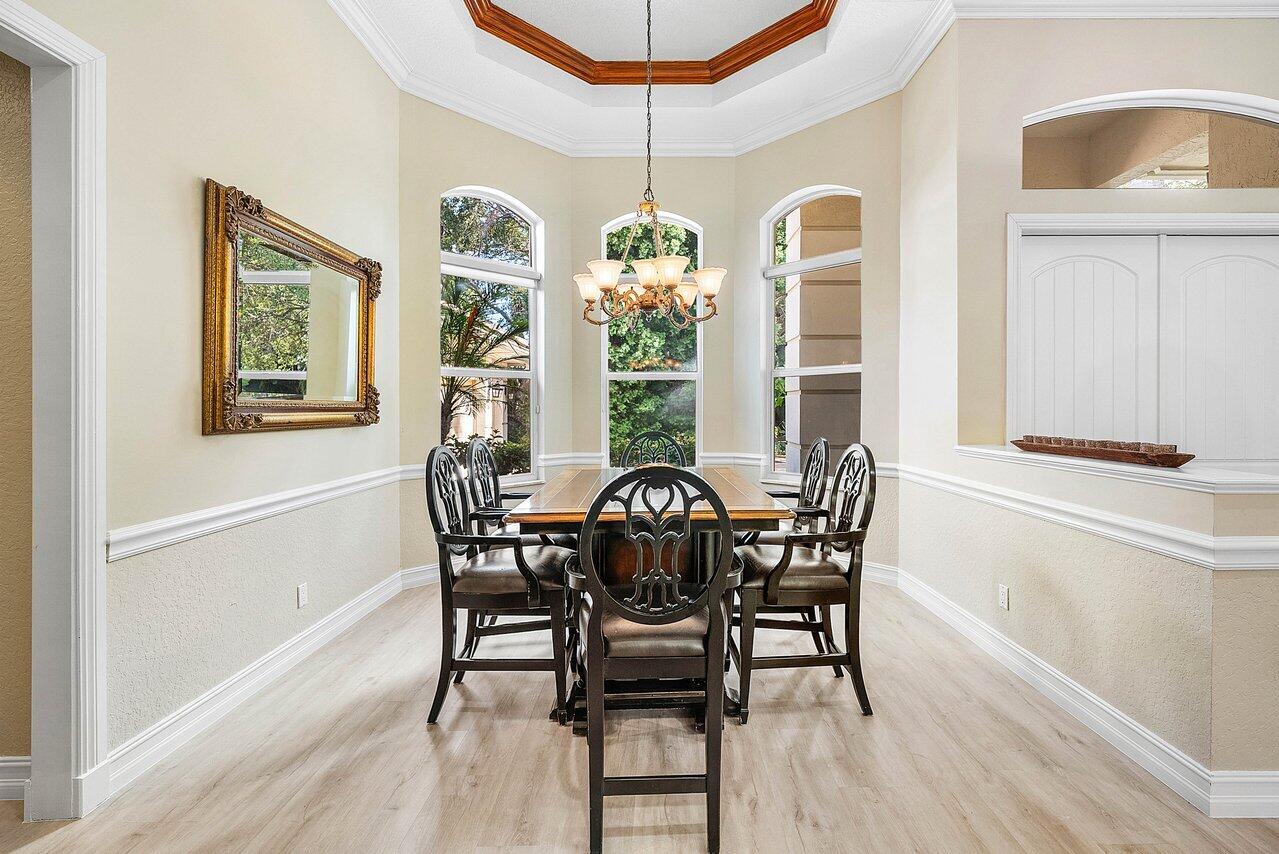 2560 Whispering Oaks Lane Delray Beach, FL 33445 - Photo 19 of 41 a view of a dining room with furniture window and outside view