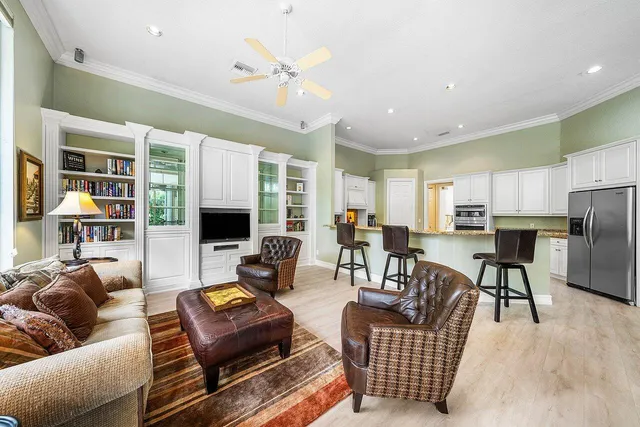 a living room with furniture fireplace and a flat screen tv