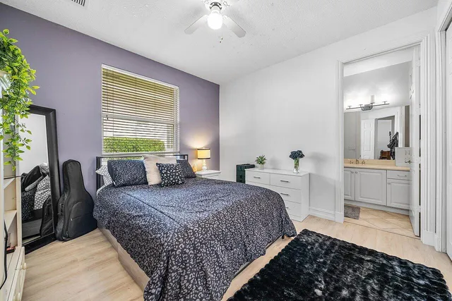 a bedroom with a bed and a view of bedroom