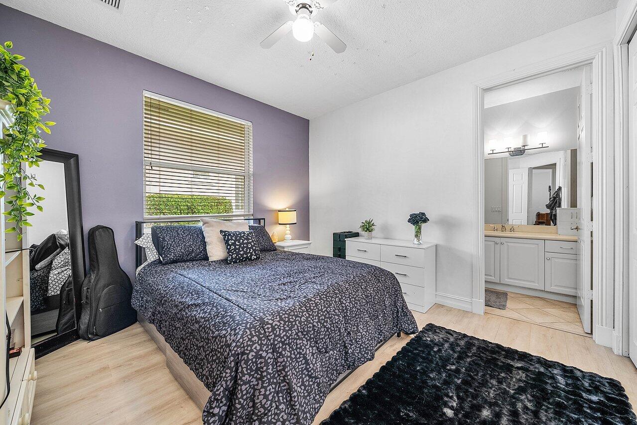 2560 Whispering Oaks Lane Delray Beach, FL 33445 - Photo 31 of 41 a bedroom with a bed and a view of bedroom