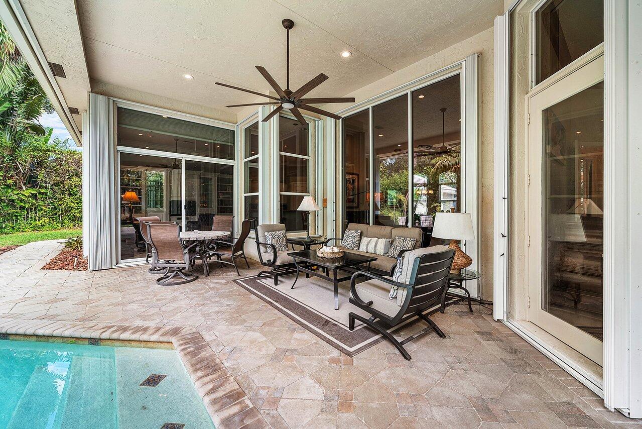 2560 Whispering Oaks Lane Delray Beach, FL 33445 - Photo 34 of 41 a building outdoor space with patio furniture and potted plants
