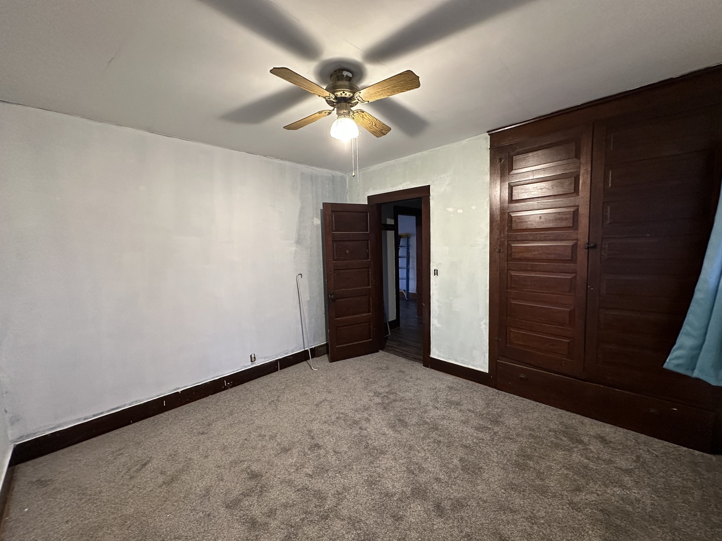 2750 North Henderson Road Freeport, IL 61032 - Photo 11 of 19 an empty room with closet and fan