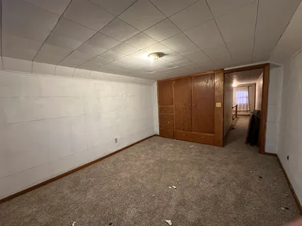 an empty room with closet area