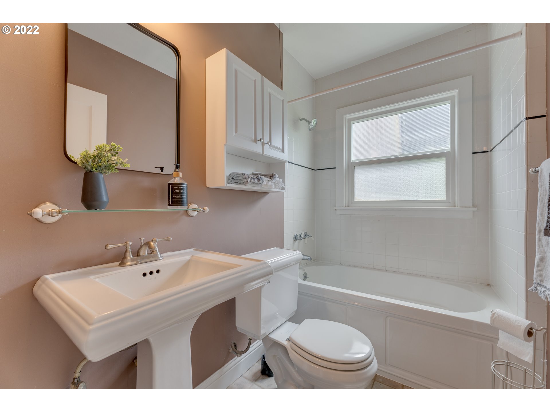 3310 Northeast 70th Avenue Portland, OR 97213 - Photo 13 of 21 a bathroom with a sink a toilet and shower