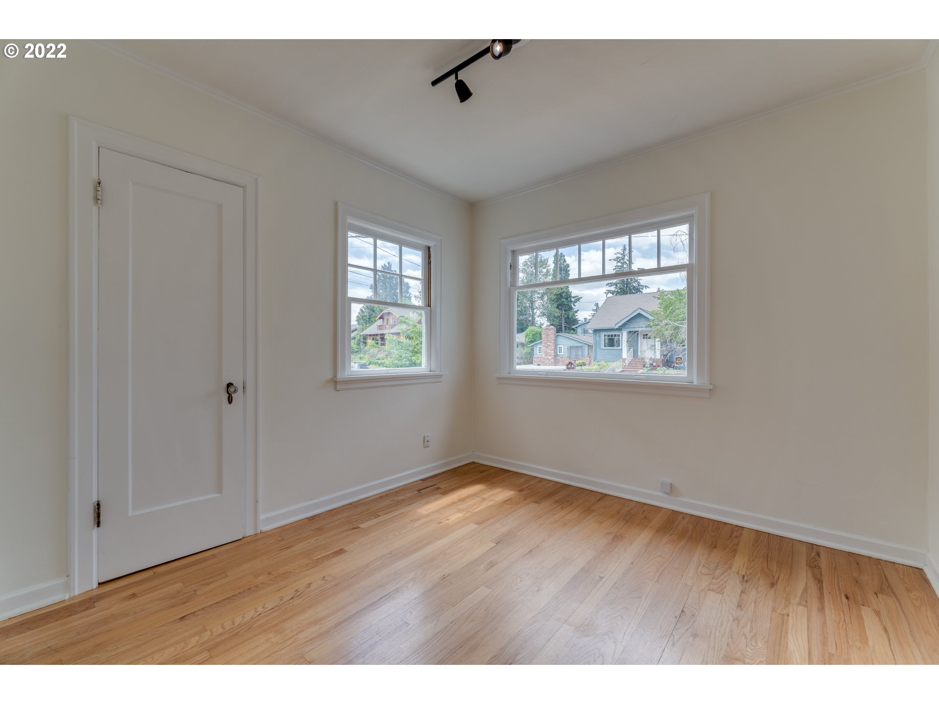 3310 Northeast 70th Avenue Portland, OR 97213 - Photo 18 of 21 a view of an empty room with wooden floor and a window