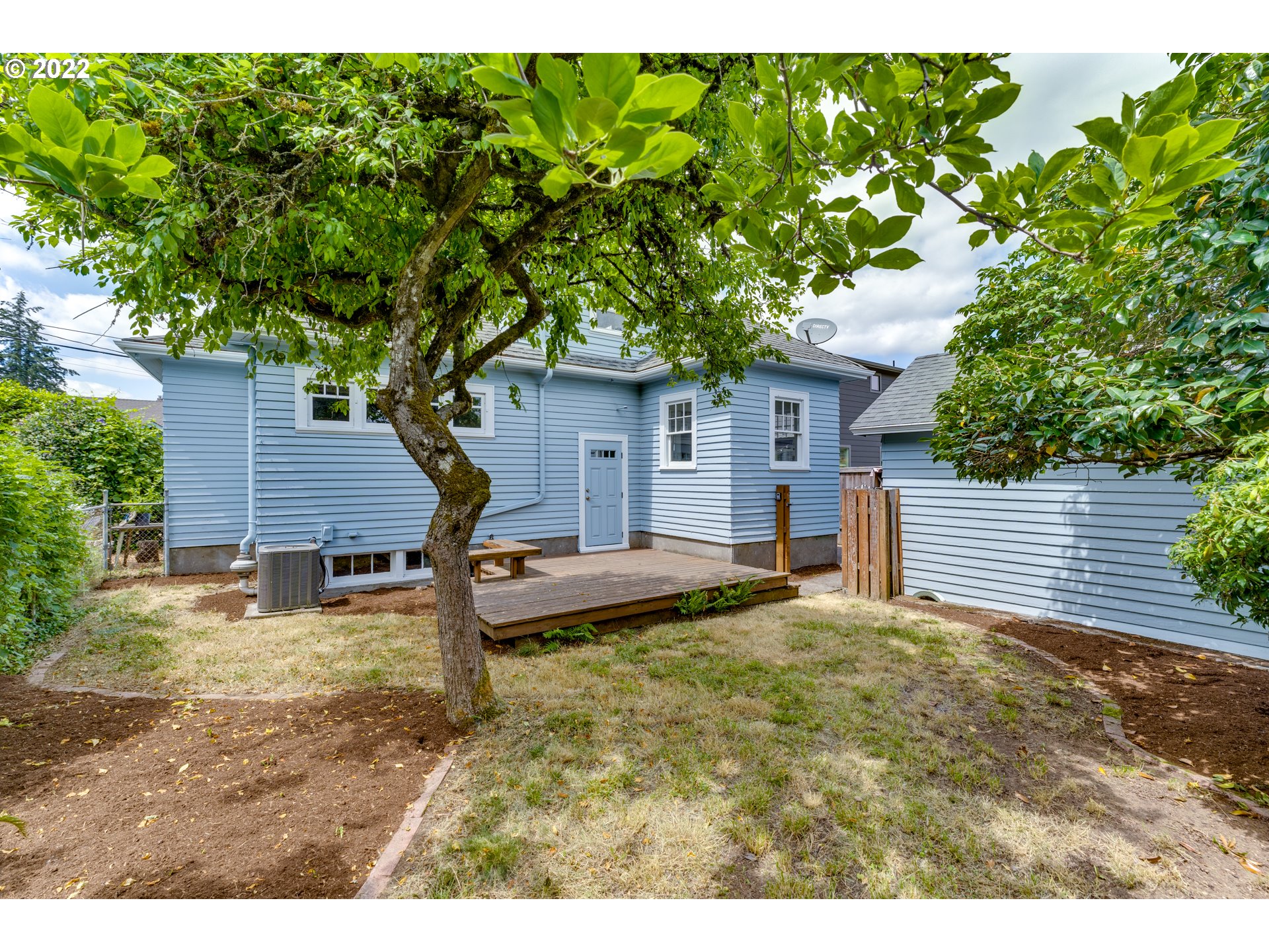 3310 Northeast 70th Avenue Portland, OR 97213 - Photo 19 of 21 a view of a house with a yard and large tree