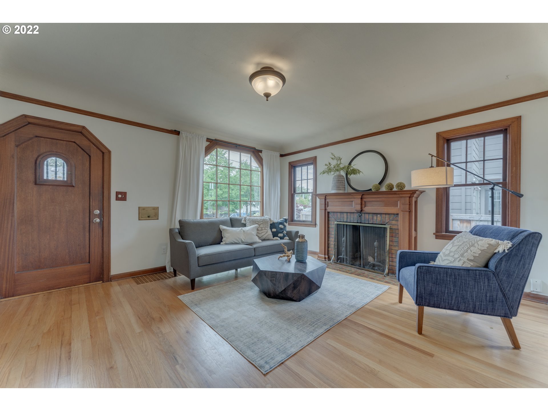 3310 Northeast 70th Avenue Portland, OR 97213 - Photo 3 of 21 a living room with furniture and a fireplace