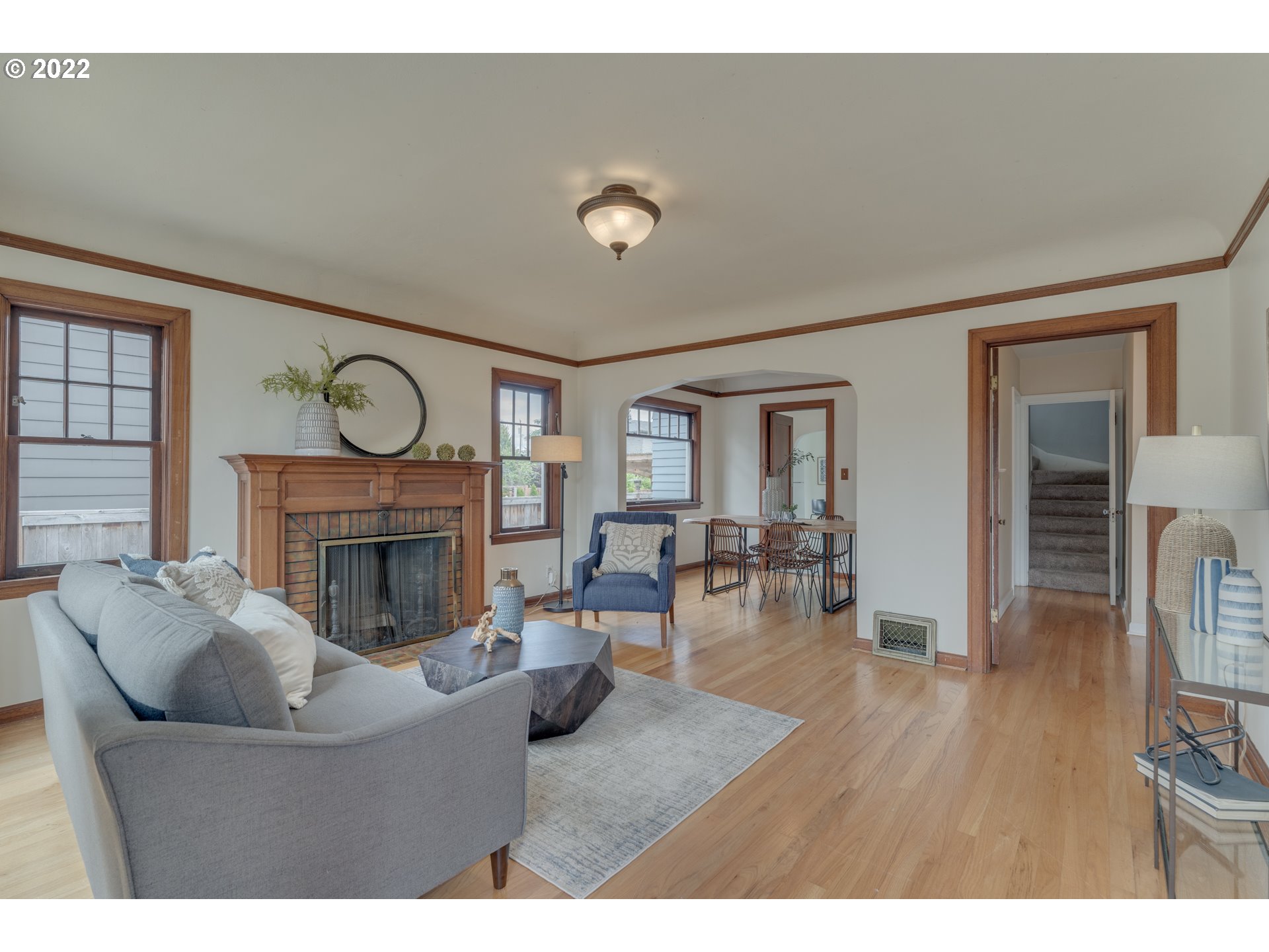 3310 Northeast 70th Avenue Portland, OR 97213 - Photo 5 of 21 a living room with furniture and a fireplace