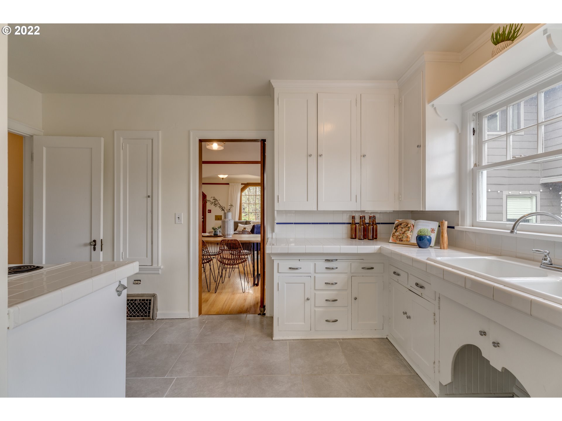 3310 Northeast 70th Avenue Portland, OR 97213 - Photo 8 of 21 a kitchen with cabinets and window