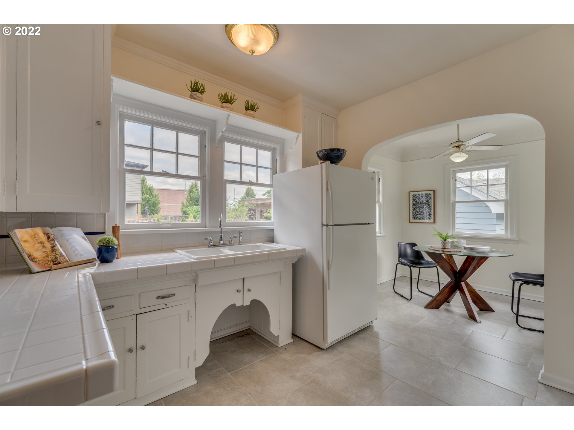 3310 Northeast 70th Avenue Portland, OR 97213 - Photo 9 of 21 a living room with furniture a dining table and a refrigerator