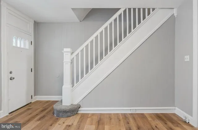 a view of entryway with wooden floor