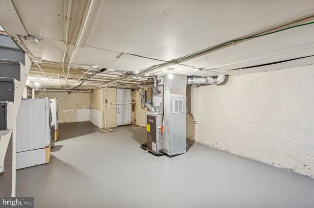 a view of a storage & utility room with a sink