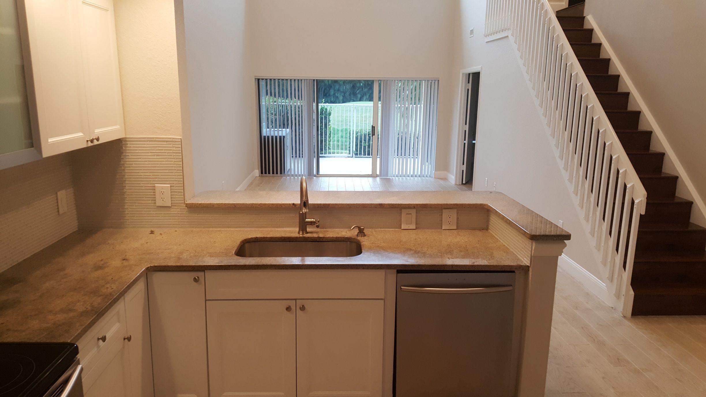 17046 Boca Club Boulevard, Unit 6 Boca Raton, FL 33487 - Photo 5 of 16 a kitchen with sink and window