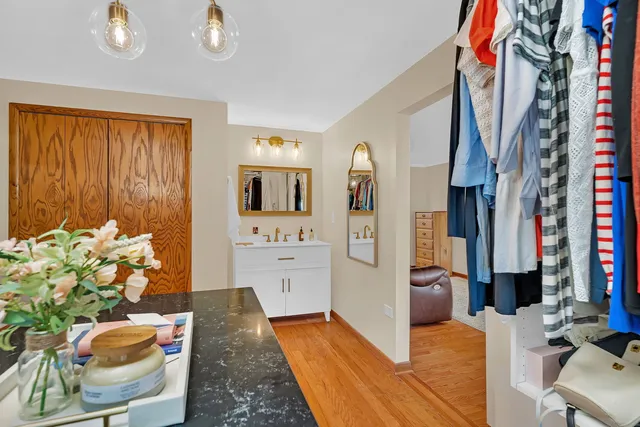 a living room with furniture flowerpot and a window
