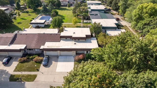 an aerial view of a house with swimming pool