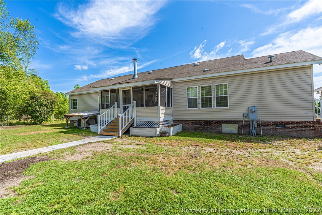 270 Morrison Bridge Road Vass, NC 28394 - Photo 44 of 50 a view of a house with backyard porch and sitting area