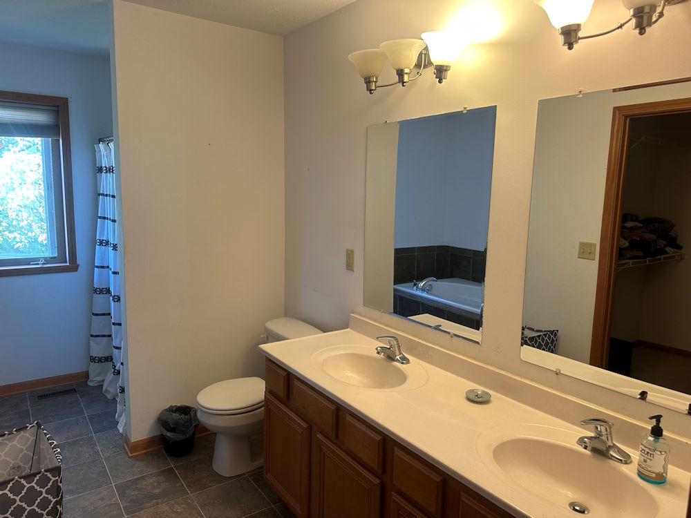 519 South Regulators Street Rochelle, IL 61068 - Photo 16 of 19 a bathroom with a sink and a mirror
