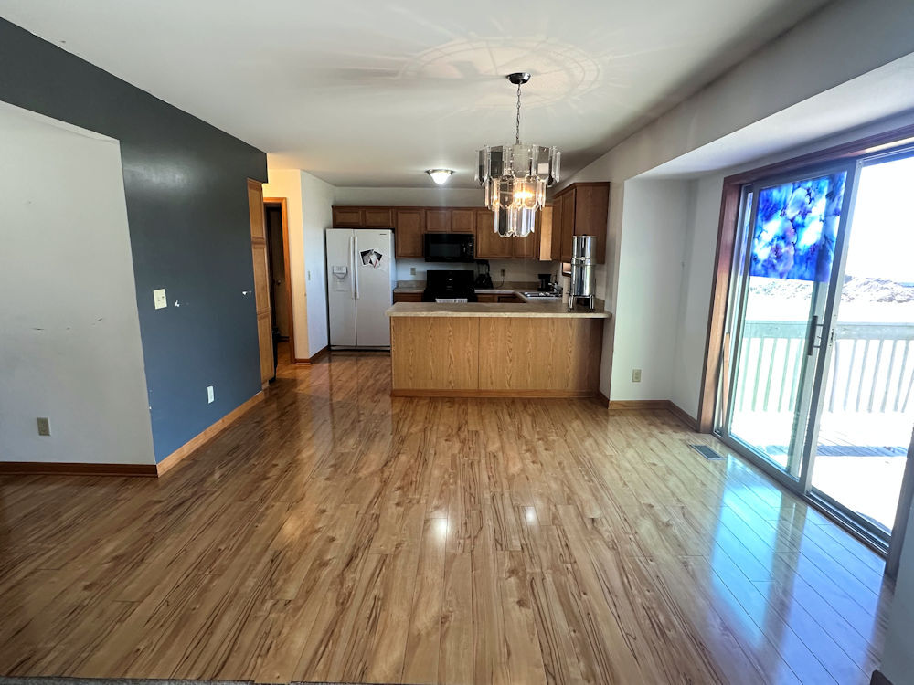 519 South Regulators Street Rochelle, IL 61068 - Photo 3 of 19 a large kitchen with stainless steel appliances granite countertop a large window