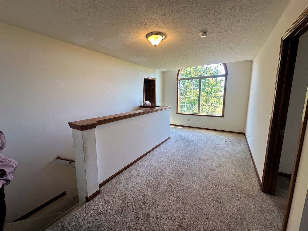 519 South Regulators Street Rochelle, IL 61068 - Photo 9 of 19 a view of an empty room with a window