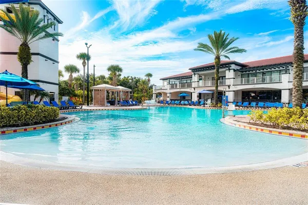 a view of a swimming pool with a yard