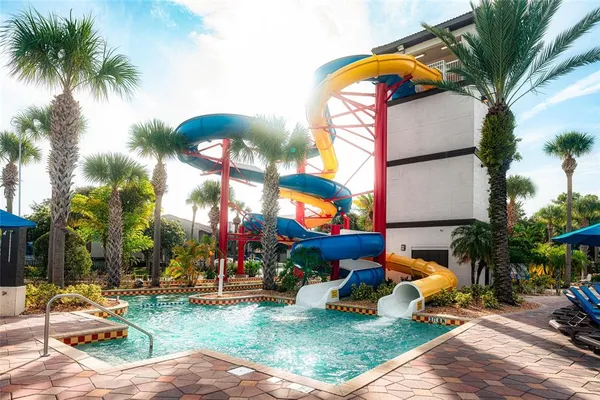 a view of a park with swings and slides