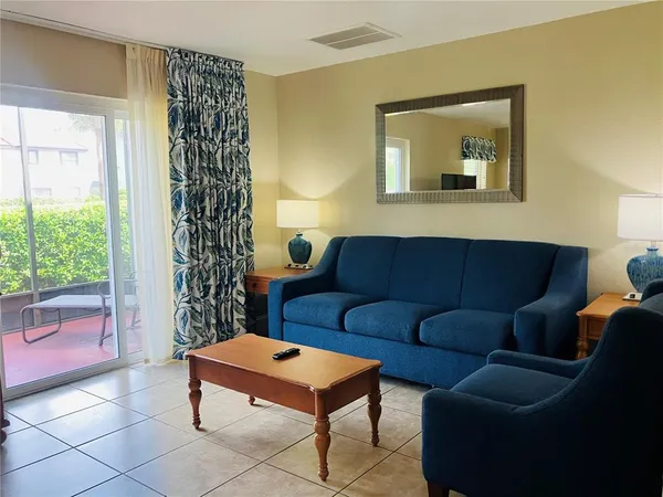 a living room with furniture and a large window