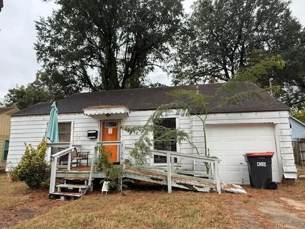 front view of house with a car parked