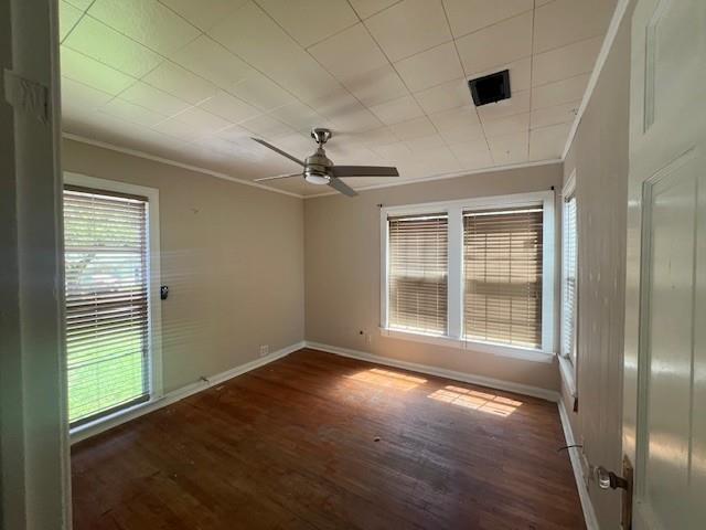 2106 Cleveland Street Paris, TX 75460 - Photo 2 of 7 a view of an empty room with a window and wooden floor