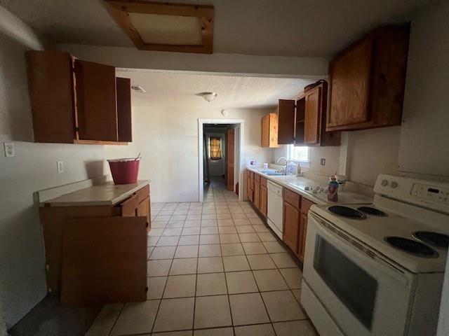 2106 Cleveland Street Paris, TX 75460 - Photo 4 of 7 a kitchen with stainless steel appliances granite countertop a stove a sink and a microwave