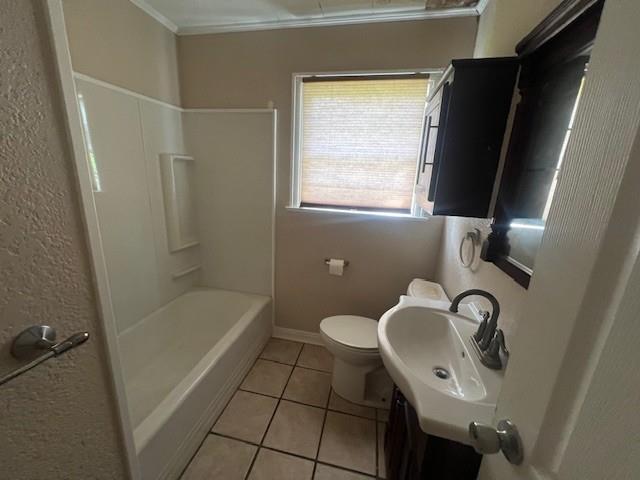 2106 Cleveland Street Paris, TX 75460 - Photo 5 of 7 a bathroom with a sink toilet and shower