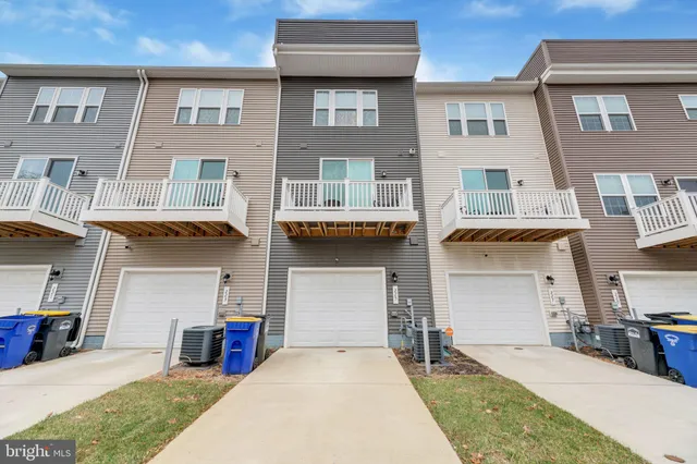a front view of a house with many windows