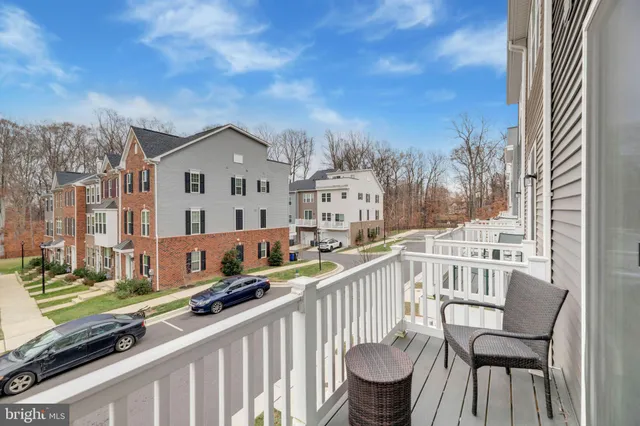 a view of a chair and tables in the balcony