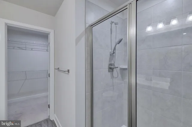 a bathroom with a glass shower door