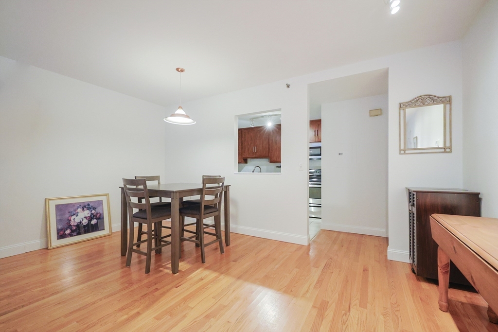69 East Berkeley Street, Unit 1 Boston, MA 02118 - Photo 11 of 20 a view of a dining room with furniture and wooden floor