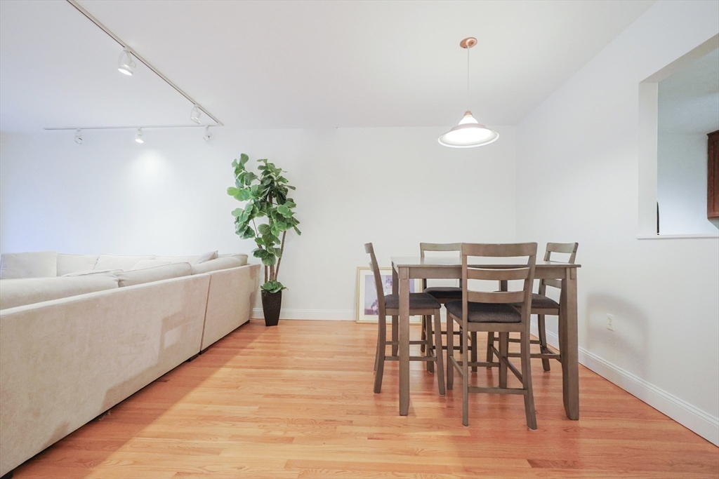 69 East Berkeley Street, Unit 1 Boston, MA 02118 - Photo 12 of 20 a view of a dining room with furniture and wooden floor