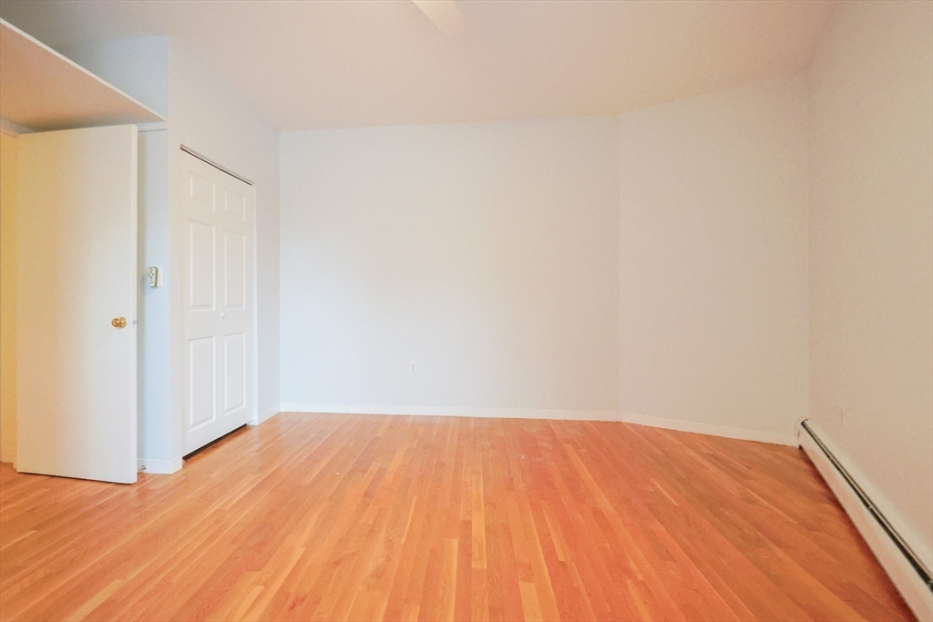 69 East Berkeley Street, Unit 1 Boston, MA 02118 - Photo 15 of 20 a view of empty room with wooden floor