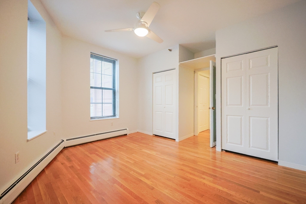 69 East Berkeley Street, Unit 1 Boston, MA 02118 - Photo 16 of 20 a view of an empty room with wooden floor and a window