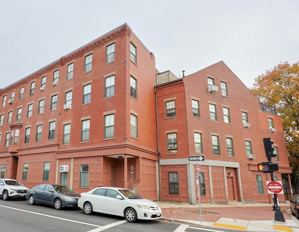 69 East Berkeley Street, Unit 1 Boston, MA 02118 - Photo 20 of 20 a front view of a building with lot of cars and trees