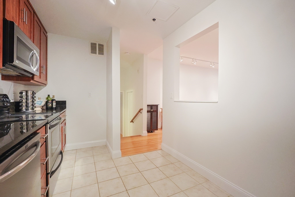 69 East Berkeley Street, Unit 1 Boston, MA 02118 - Photo 4 of 20 a view of a kitchen from the hallway
