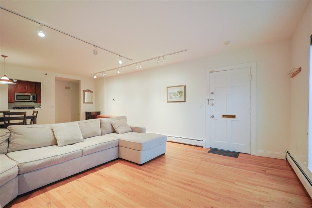 69 East Berkeley Street, Unit 1 Boston, MA 02118 - Photo 6 of 20 a living room with furniture and a flat screen tv